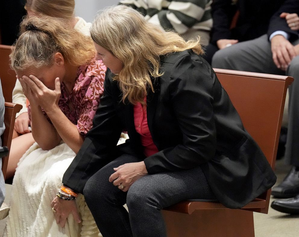 PHOTO: Debbie Hixon reaches out to her sister-in-law, Natalie Hixon as the verdicts are announced in the trial of MSD High School shooter Nikolas Cruz at the Broward County Courthouse in Fort Lauderdale, Fla., Oct. 13, 2022.