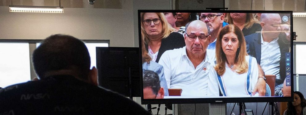 PHOTO: Relatives of MSD High School shooting victims are seen reacting on a TV screen as the judge reads the jury verdict in the penalty phase of the trial of shooter Nikolas Cruz at the Broward County Courthouse in Fort Lauderdale, Fla., Oct. 13, 2022.