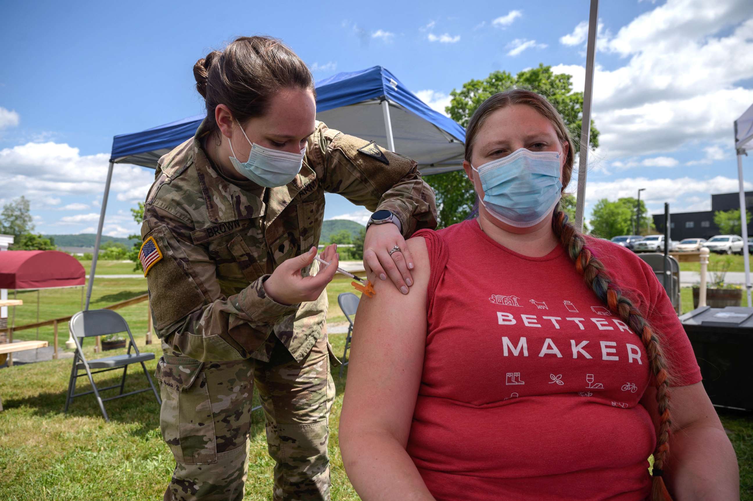 PHOTO: An employee receives a vaccination against Covid-19 from a National Guard soldier at a pop-up vaccination stand at the Vermont Creamery in Websterville, Vt., June 29, 2021.