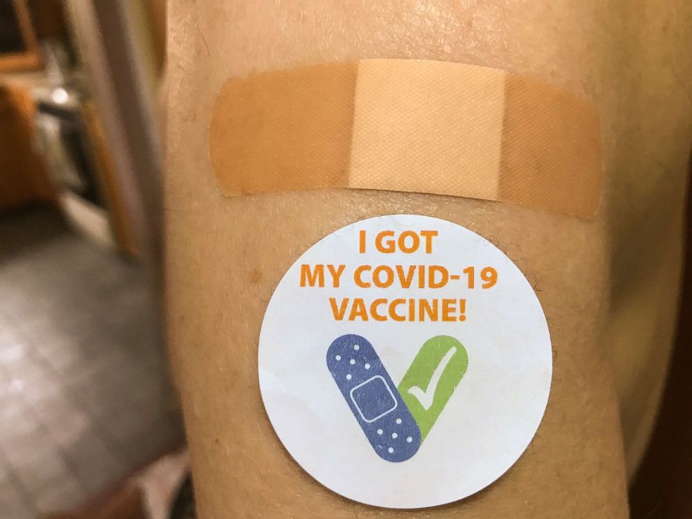 PHOTO: A Vermonter displays a post-vaccination sticker in Burlington, Vt., on March 4, 2021.