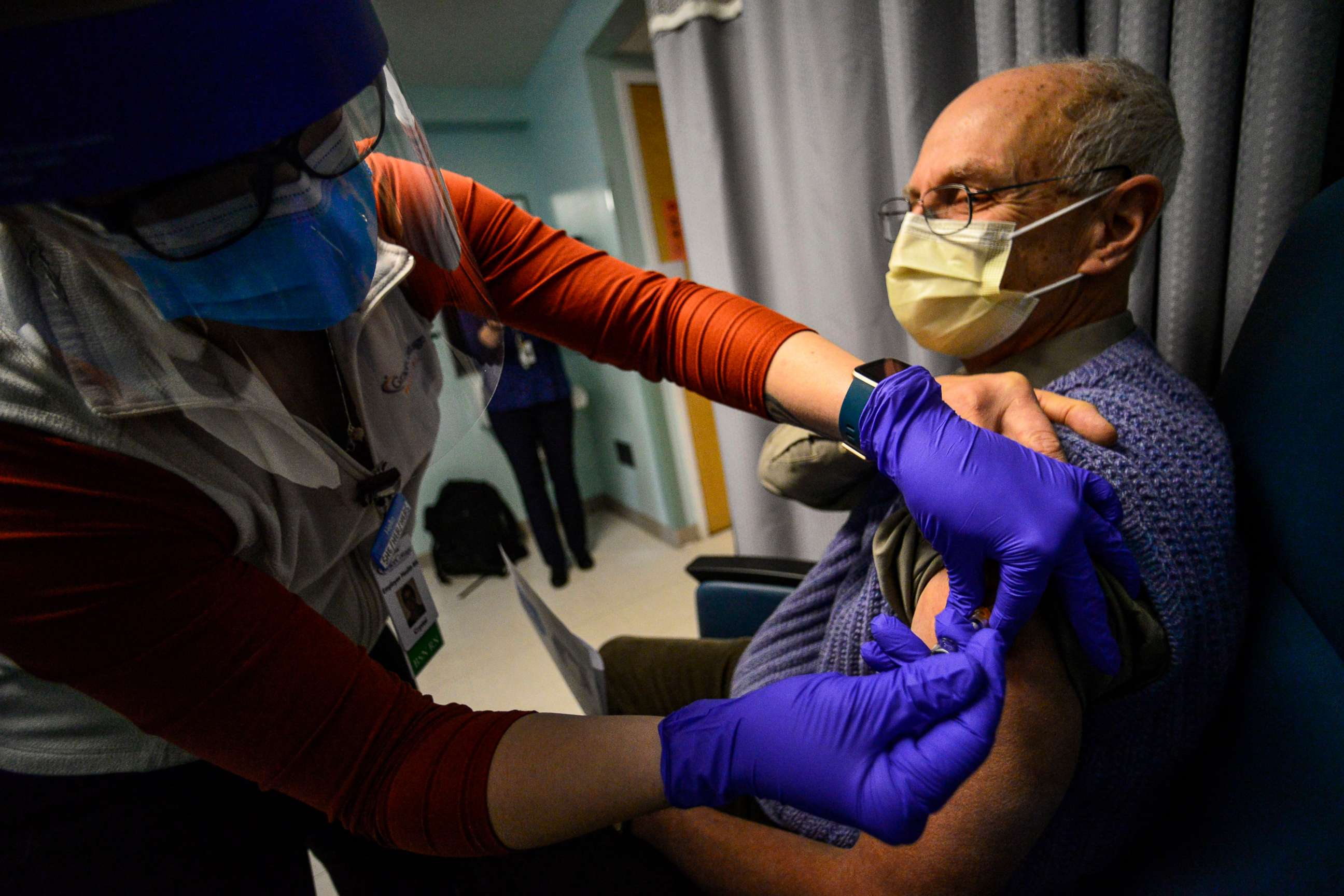 PHOTO: A registered nurse with Grace Cottage Family Health & Hospital, in Townshend, Vt., administers a COVID-19 vaccine to Timothy Shafer, clinical physician and president of the medical staff, on Dec. 16, 2020.