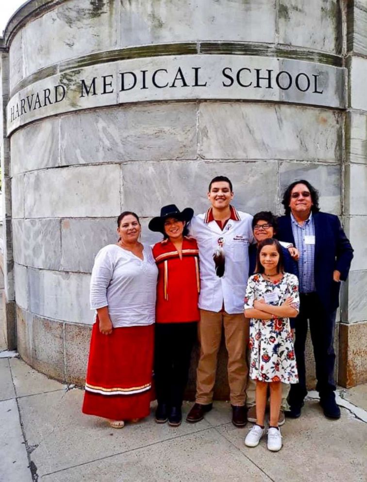 PHOTO: Victor Lopez-Carmen with his parents and siblings at Harvard Medical School.