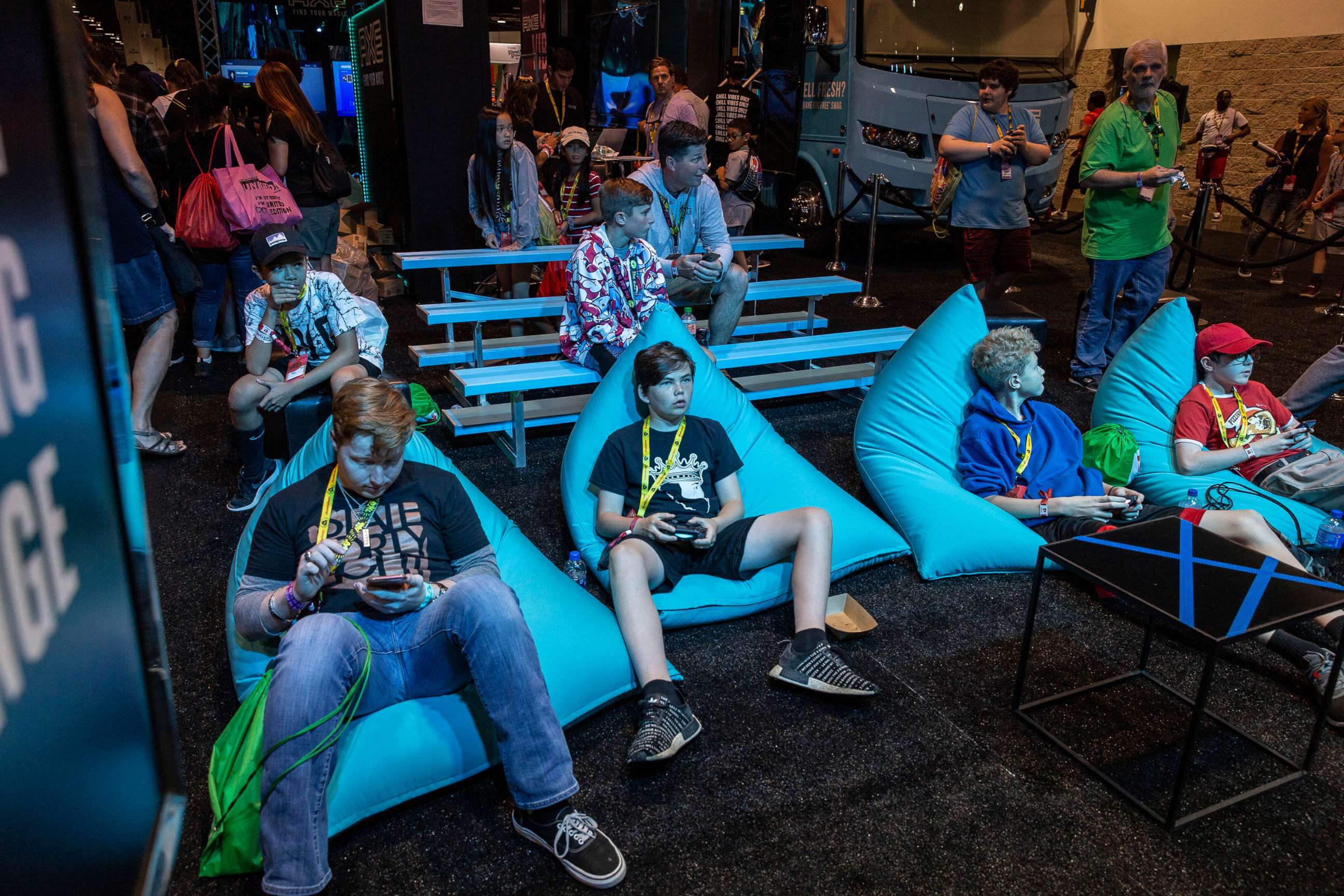 PHOTO: Attendees play video games at the Axe booth at VidCon in Anaheim, Calif., July 11, 2019. 