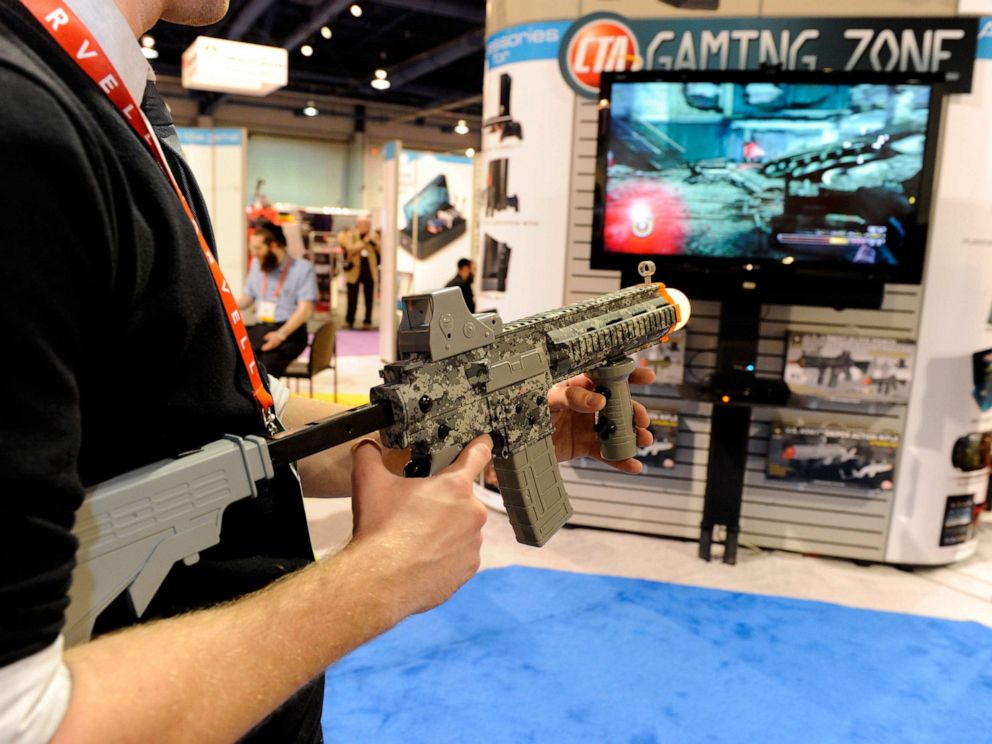 PHOTO: A player uses a U.S. Army Elite Force Assault Rifle Controller to play a video game at the CTA Digital booth at the 2012 International Consumer Electronics Show, January 12, 2012, in Las Vegas.