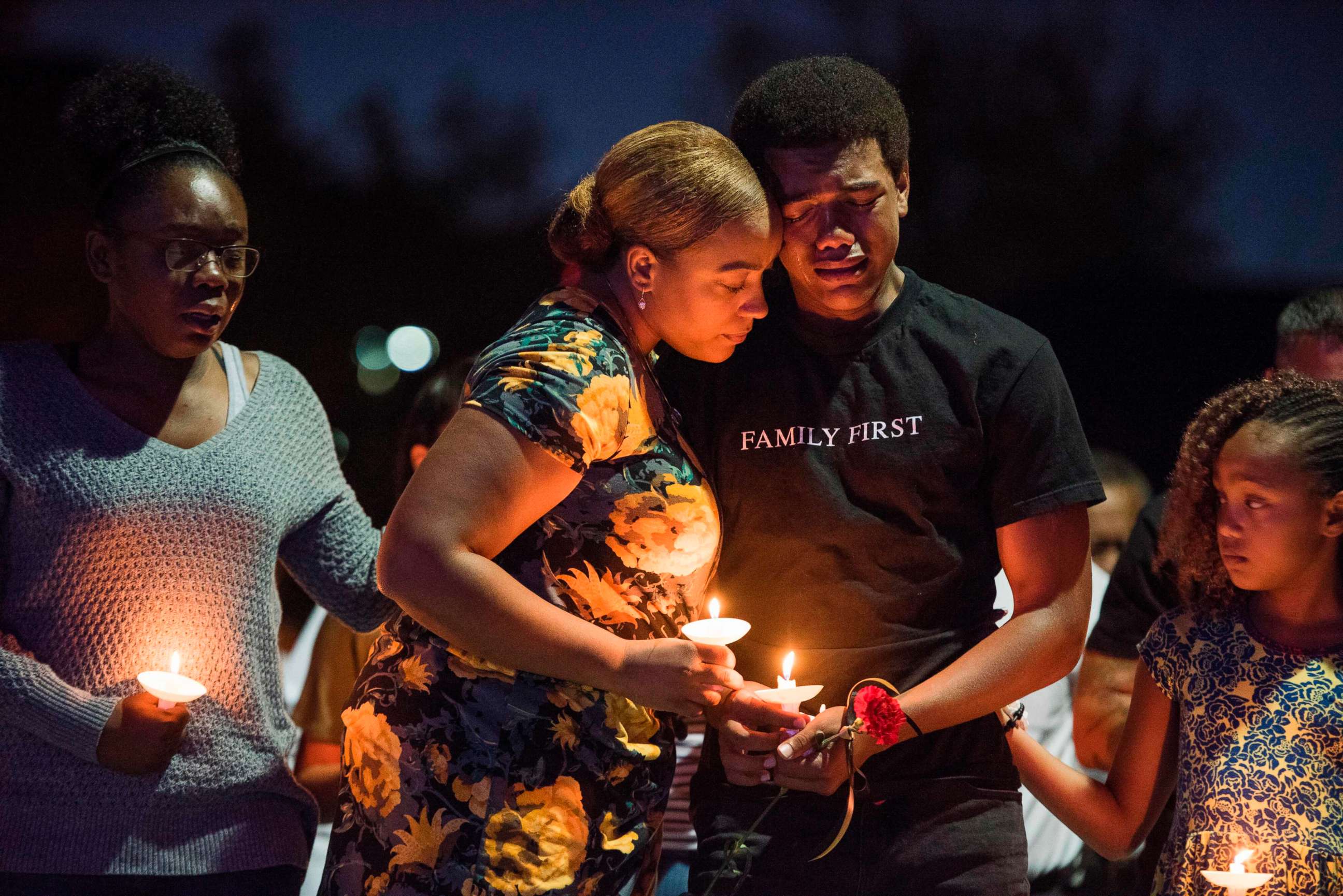 PHOTO: Veronica Hartfield (2L) widow of Las Vegas Metropolitan Police Department Officer Charleston Hartfield, and their family attend a vigil for Charleston Hartfield at Police Memorial Park, Oct. 5, 2017 in Las Vegas.