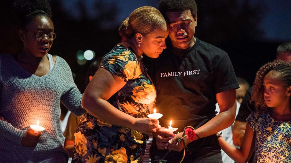 PHOTO: Veronica Hartfield (2L) widow of Las Vegas Metropolitan Police Department Officer Charleston Hartfield, and their family attend a vigil for Charleston Hartfield at Police Memorial Park, Oct. 5, 2017 in Las Vegas.