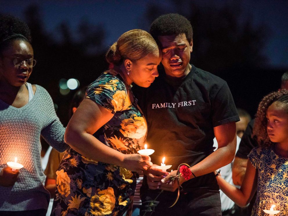 PHOTO: Veronica Hartfield (2L) widow of Las Vegas Metropolitan Police Department Officer Charleston Hartfield, and their family attend a vigil for Charleston Hartfield at Police Memorial Park, Oct. 5, 2017 in Las Vegas.