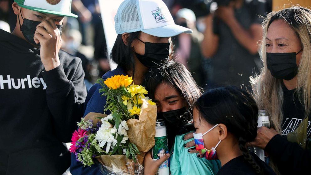 PHOTO: Family members mourn at a vigil for victims of a shooting at a rail yard run by the Santa Clara Valley Transportation Authority in San Jose, Calif., May 27, 2021.