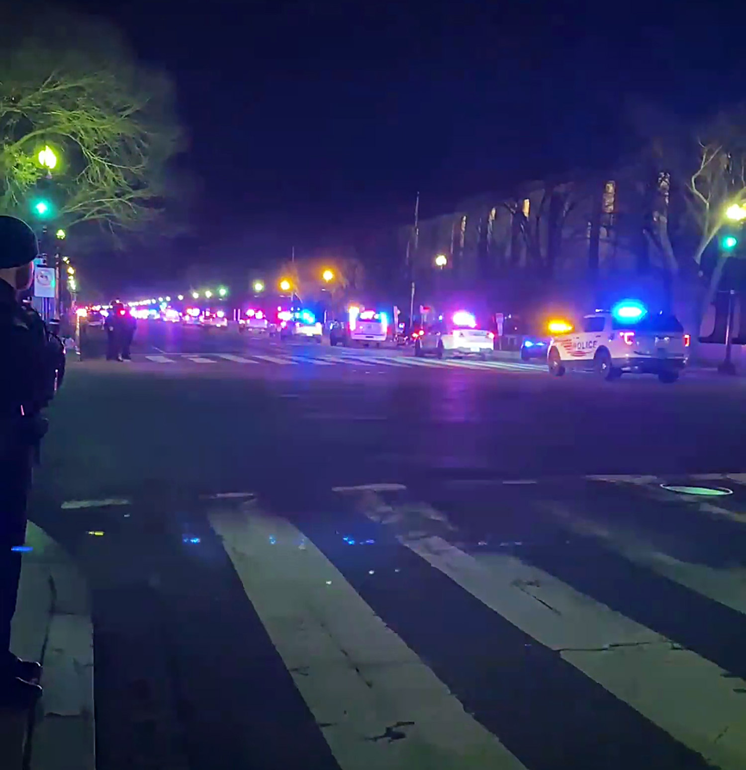 PHOTO: A motorcade of police vehicles honor police officer Brian Sicknick, Jan. 7, 2021, in Washington, D.C., who died from injuries sustained as pro-Trump protesters stormed the U.S. Capitol building.