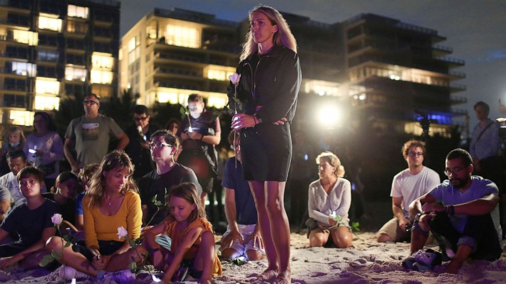 PHOTO: People attend a vigil in honor of residents of a partially collapsed residential building as the emergency crews continue search and rescue operations for survivors, in Surfside, near Miami Beach, Fla., June 28, 2021.
