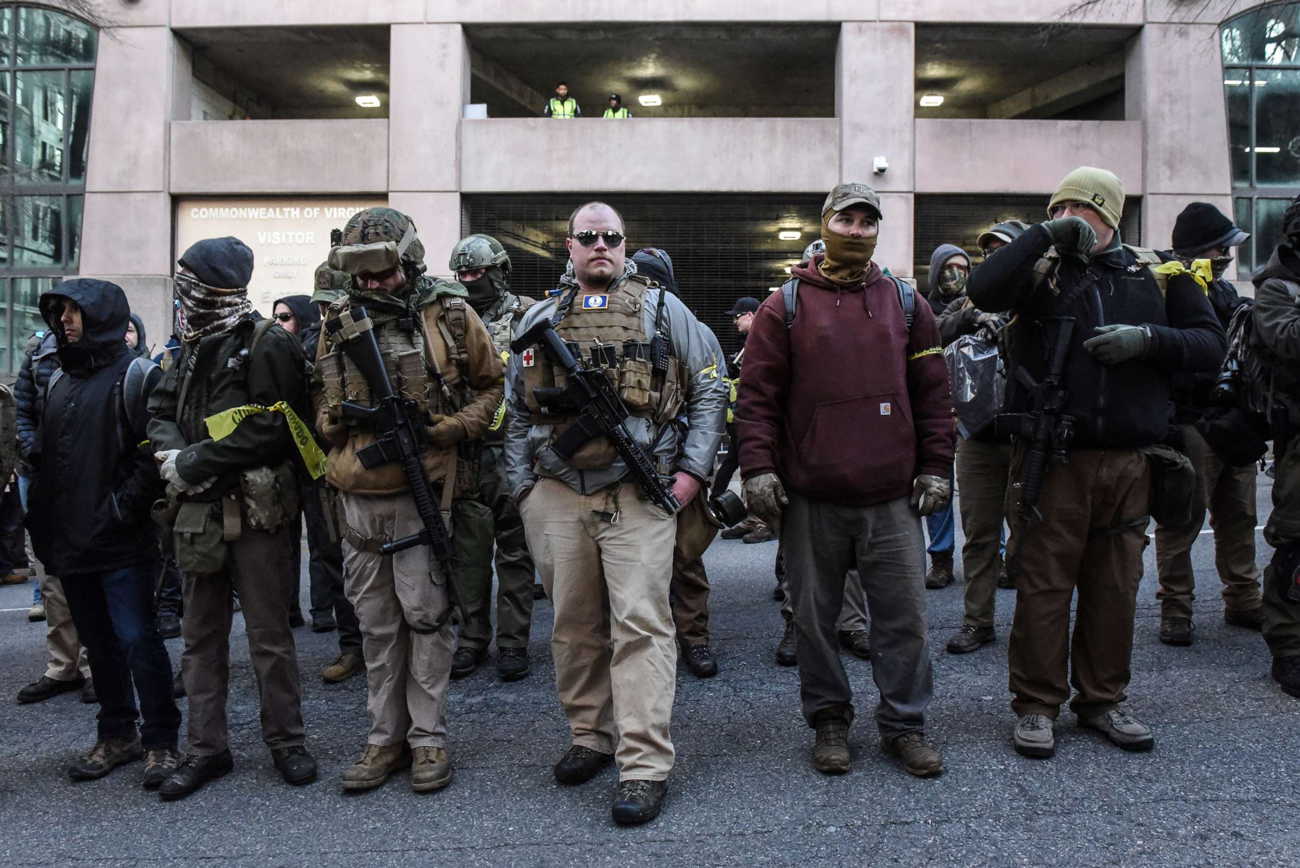 PHOTO: People who are part of an armed militia group arrive near the Virginia State Capitol building to advocate for gun rights in Richmond, Va. January 20, 2020. 