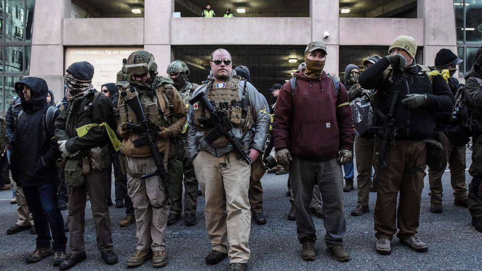 PHOTO: People who are part of an armed militia group arrive near the Virginia State Capitol building to advocate for gun rights in Richmond, Va. January 20, 2020. 