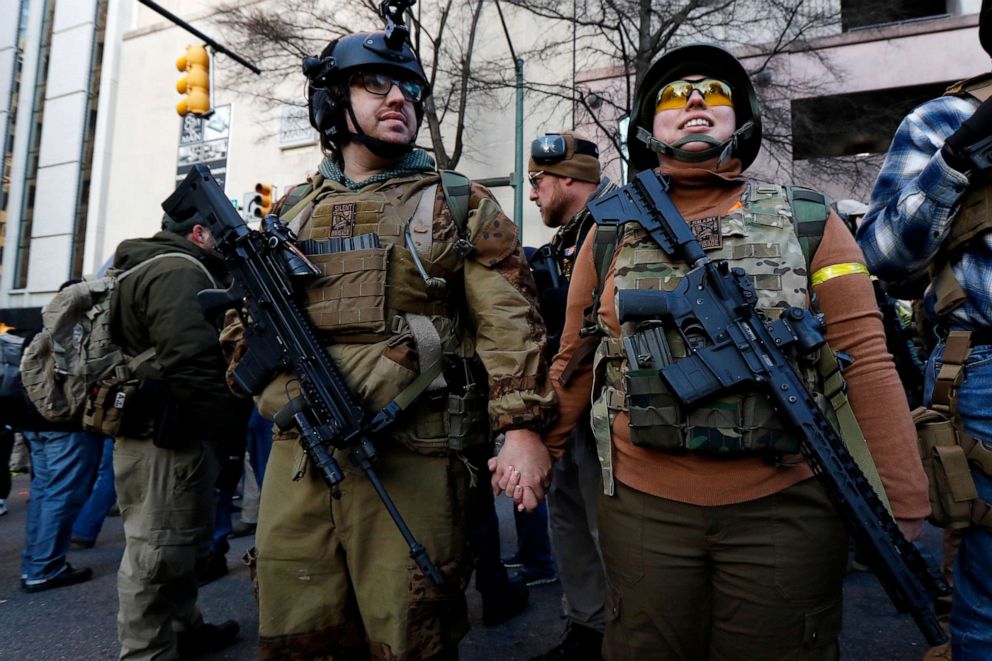 PHOTO: Demonstrators stand outside a security zone before a pro-gun rally, Jan. 20, 2020, in Richmond, Va. 