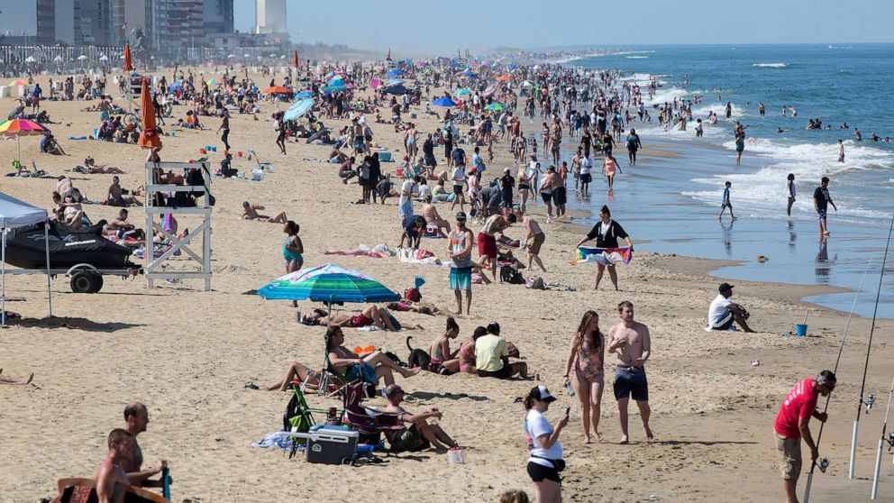 PHOTO: Warm weather draws crowds to the oceanfront, May 16, 2020, in Virginia Beach, Va.