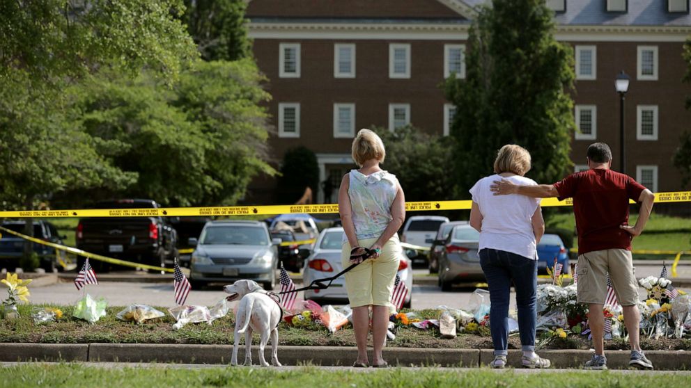 PHOTO: People stop to pay their respects to those killed in a mass shooting at a makeshift memorial outside the City of Virginia Beach Operations Building, June 2, 2019, in Virginia Beach, Vir.