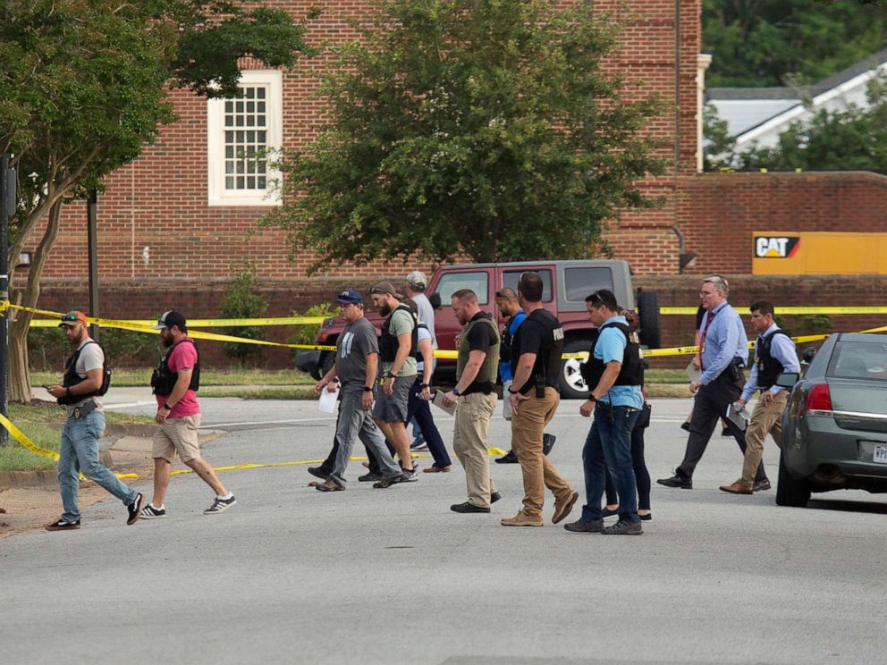 PHOTO: Police work the scene where eleven people were killed during a mass shooting at the Virginia Beach city public works building, May 31, 2019 in Virginia Beach, Va.