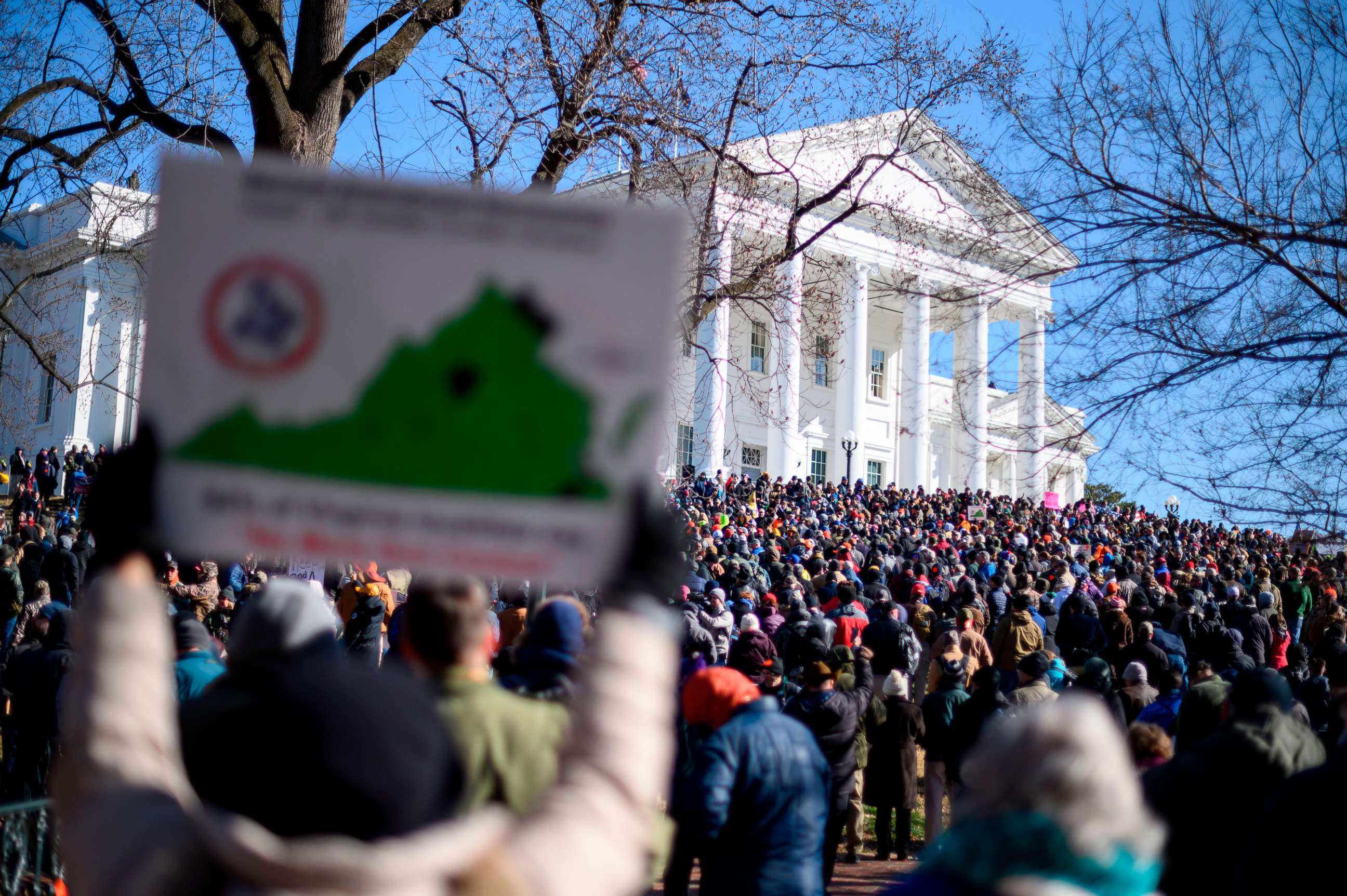 PHOTO: People gather in front of the Virginia State Capitol during a gun rights rally in Richmond, Va., Jan. 20, 2020.