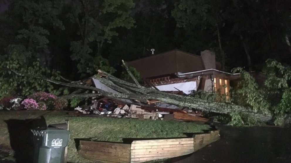 A tree crushed a home in Reston, Virginia, after severe storms hit the mid-Atlantic region on Monday, May 14, 2018.