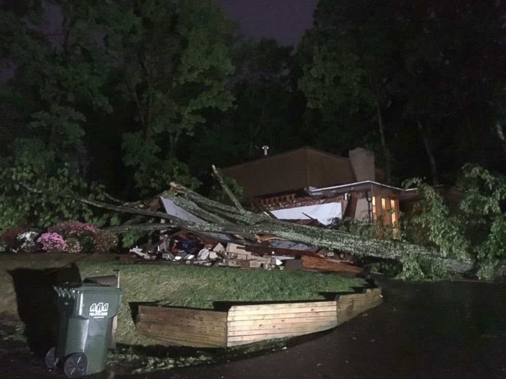 A tree crushed a home in Reston, Virginia, after severe storms hit the mid-Atlantic region on Monday, May 14, 2018.