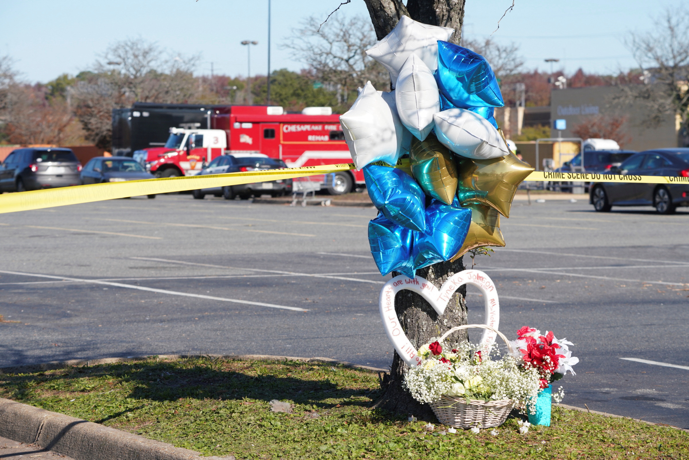 PHOTO: A memorial is seen in the parking lot after a mass shooting at a Walmart in Chesapeake, Virginia, Nov. 23, 2022.