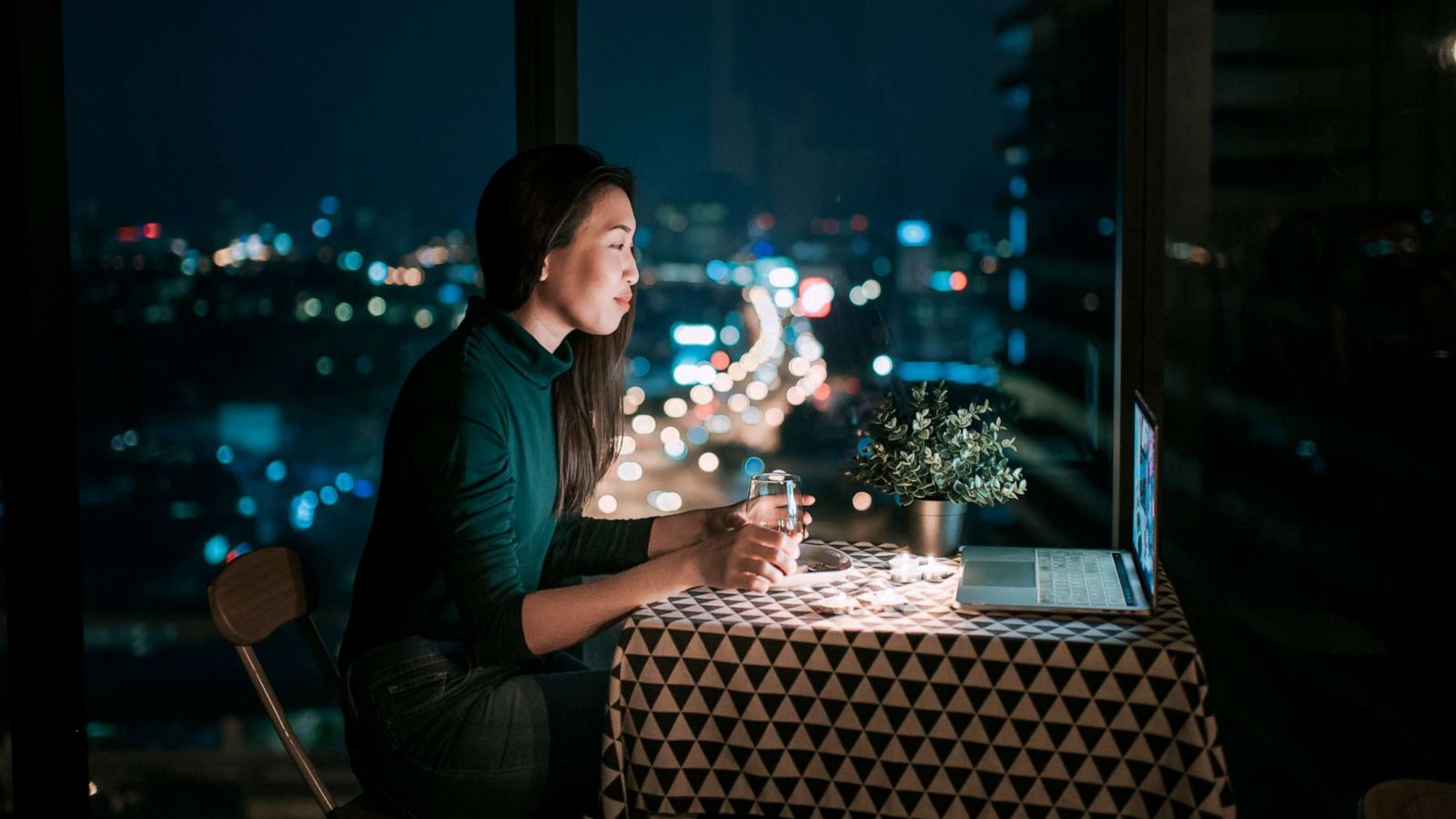 PHOTO: A woman uses a laptop for a virtual date in this stock photo.