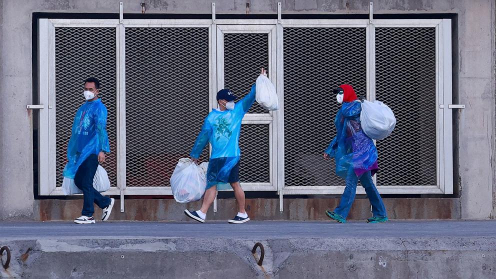 PHOTO: Tourists disembark from the cruise ship MV Hondius, affected by a hantavirus outbreak, after it docked at the port of Granadilla de Abona, Tenerife, Spain May 11, 2026.