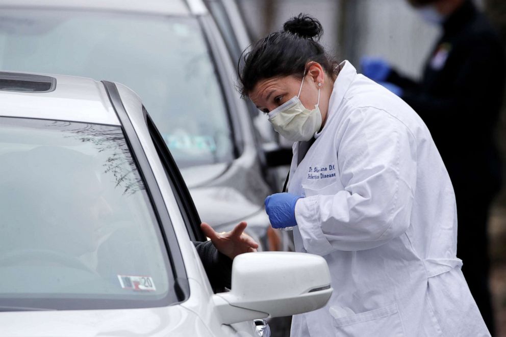 PHOTO: Cars line up outside the Central Outreach Wellness Center in Pittsburgh Monday, March 16, 2020, for drive-by testing for COVID-19. The testing, that is limited to 100 kits at present, is being done in partnership with Quest Diagnostics.