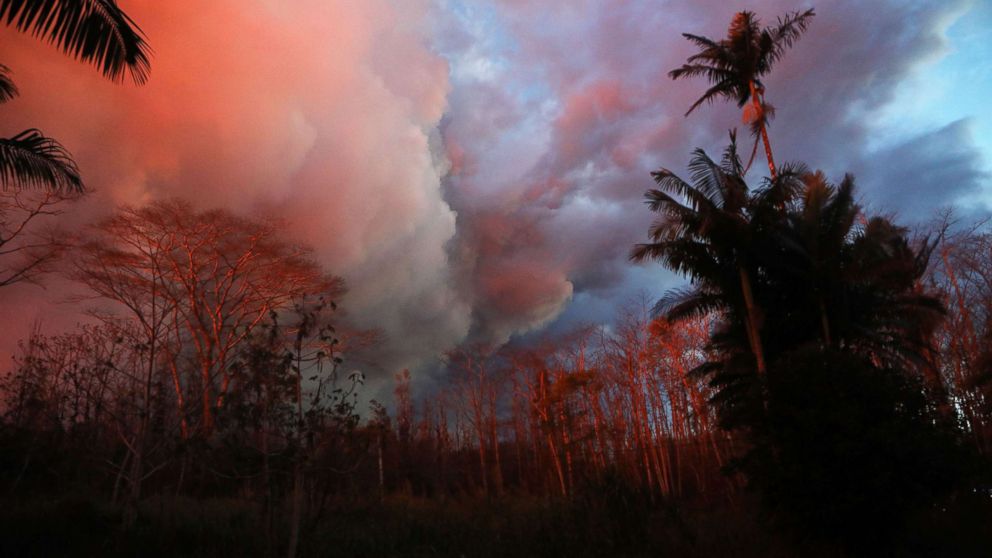 PHOTO: Lava from a Kilauea fissure illuminates dying trees in Leilani Estates, on Hawaii's Big Island, May 26, 2018 in Pahoa, Hawaii.