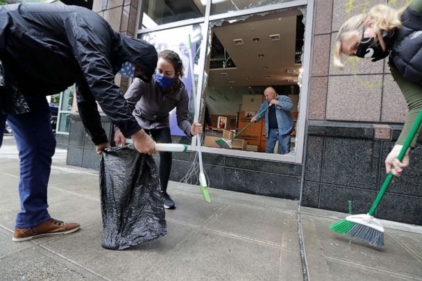 Volunteers across the US clean up glass, graffiti in wake of ...