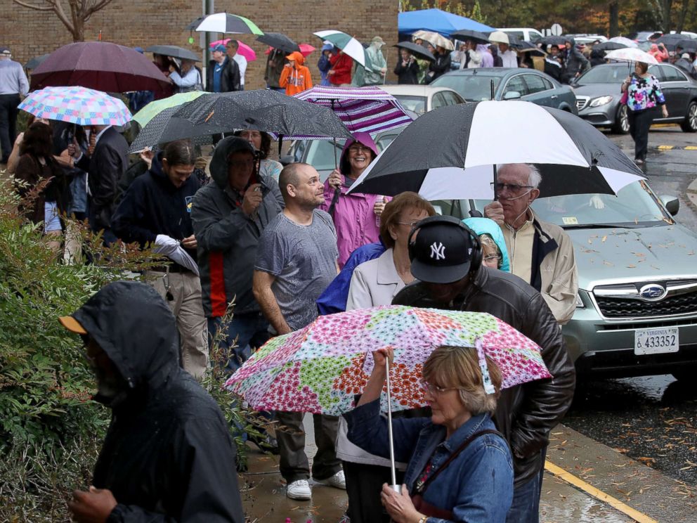 PHOTO: Virginia residents line up in the pouring rain to vote, Nov. 6, 2018 in Midlothian, Va.