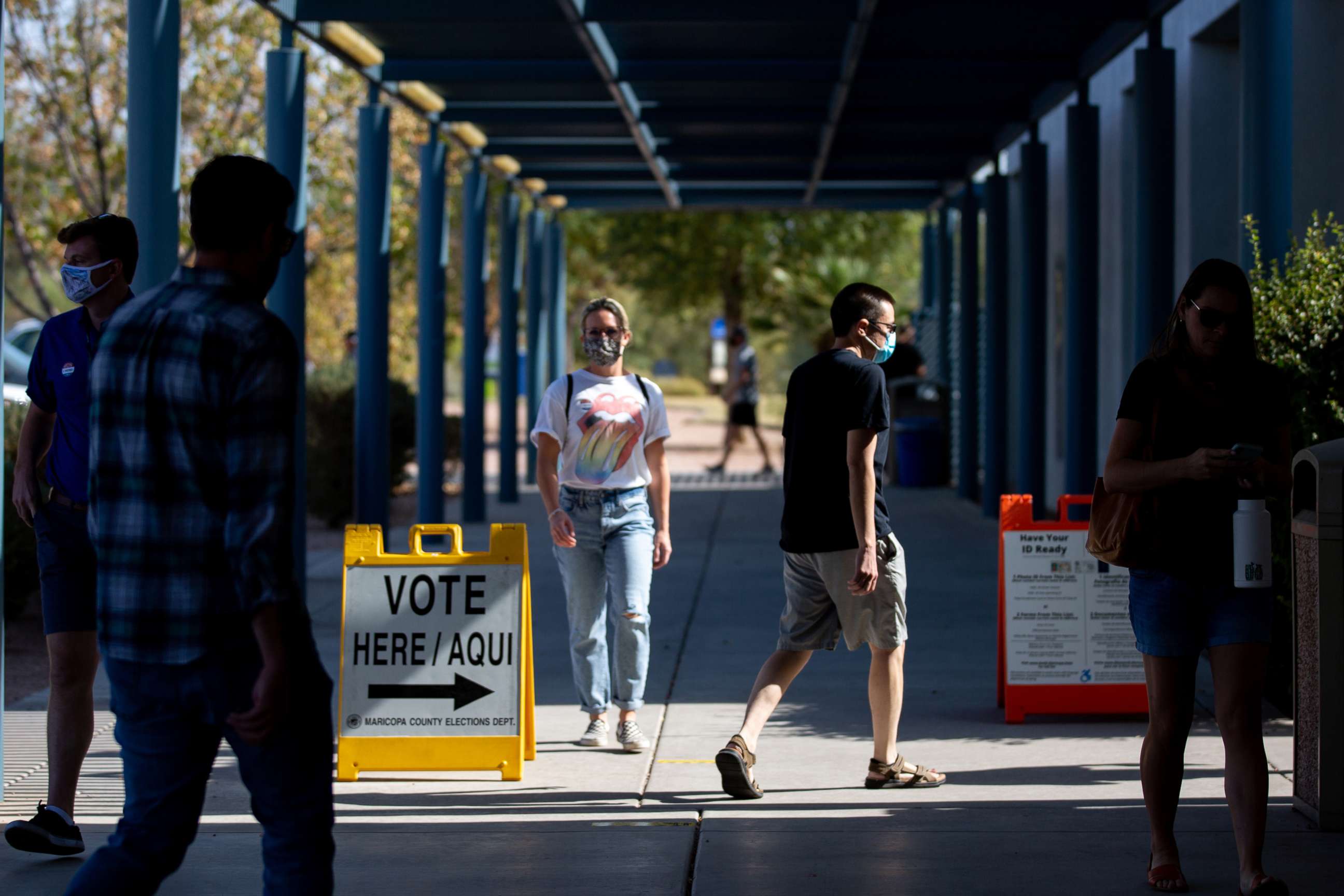 PHOTO: Voters enter Southeast Regional Library to cast their ballots, Nov. 3, 2020 in Gilbert, Ariz. 
