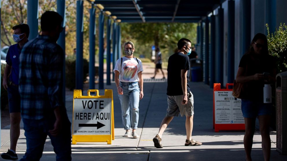 PHOTO: Voters enter Southeast Regional Library to cast their ballots, Nov. 3, 2020 in Gilbert, Ariz. 