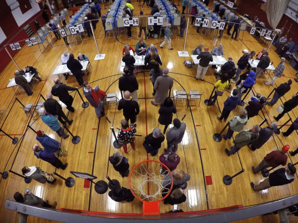 PHOTO: Voters wait in line in the gymnasium at Brunswick Junior High School to receive their ballots for the mid-term election, Nov. 6, 2018, in Brunswick, Maine.