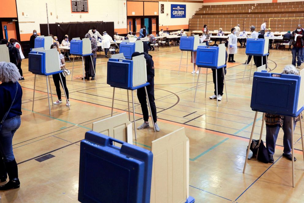 PHOTO: Voters fill out ballots at Riverside University High School during the presidential primary election, held amid the coronavirus disease (COVID-19) outbreak, in Milwaukee, Wisc., April 7, 2020.