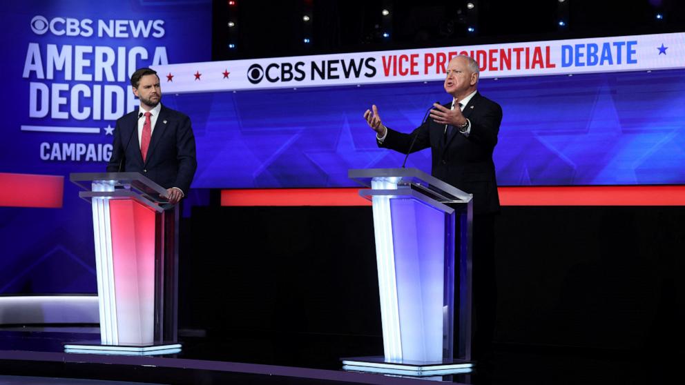 PHOTO: Republican vice presidential candidate Sen. JD Vance and Minnesota Governor and Democratic vice presidential candidate Tim Walz participate in the Vice Presidential debate in New York City, October 1, 2024.