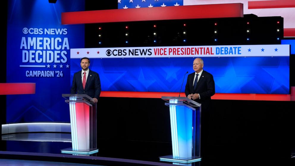 PHOTO: Republican vice presidential candidate Sen. JD Vance and Minnesota Governor and Democratic vice presidential candidate Tim Walz participate in the Vice Presidential debate in New York City, October 1, 2024.