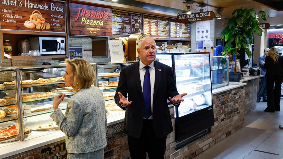 PHOTO: Democratic vice presidential candidate Minnesota Gov. Tim Walz and his wife Gwen Walz visit Justino's Pizzeria after his debate with Republican vice presidential candidate Sen. JD Vance, October 1, 2024 in New York City. 