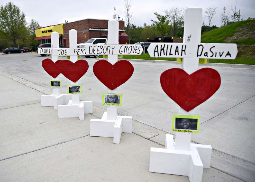 PHOTO: Crosses and hearts rest in the parking lot at the Antioch Waffle House which reopened on April 25, 2018, three days after a gunman killed four people in Nasheville, Tenn.