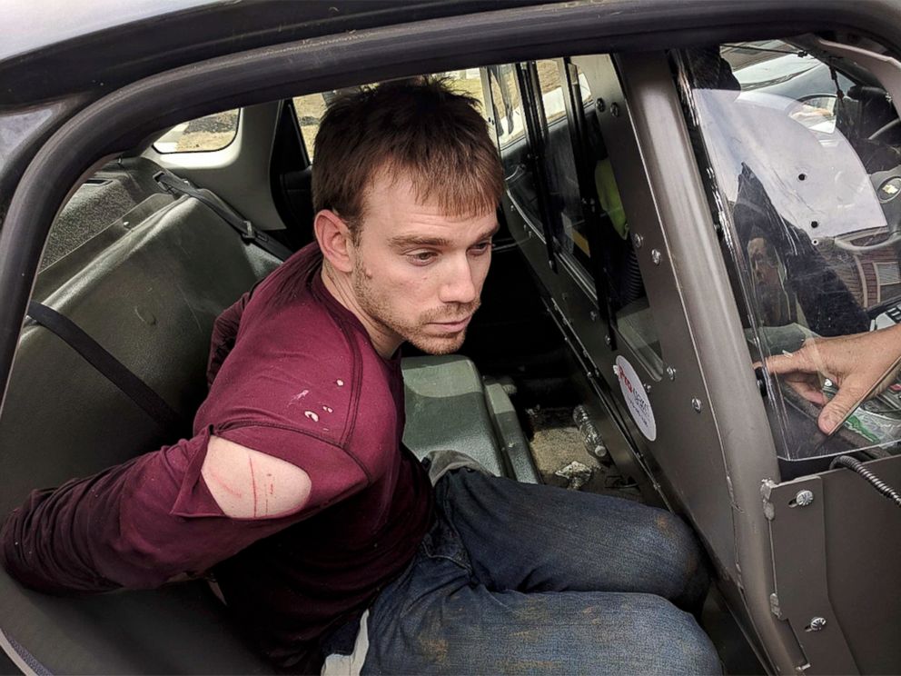 PHOTO: In this photo released by the Metro Nashville Police Department, Travis Reinking sits in a police car after being arrested in Nashville, Tenn., on April 23, 2018.