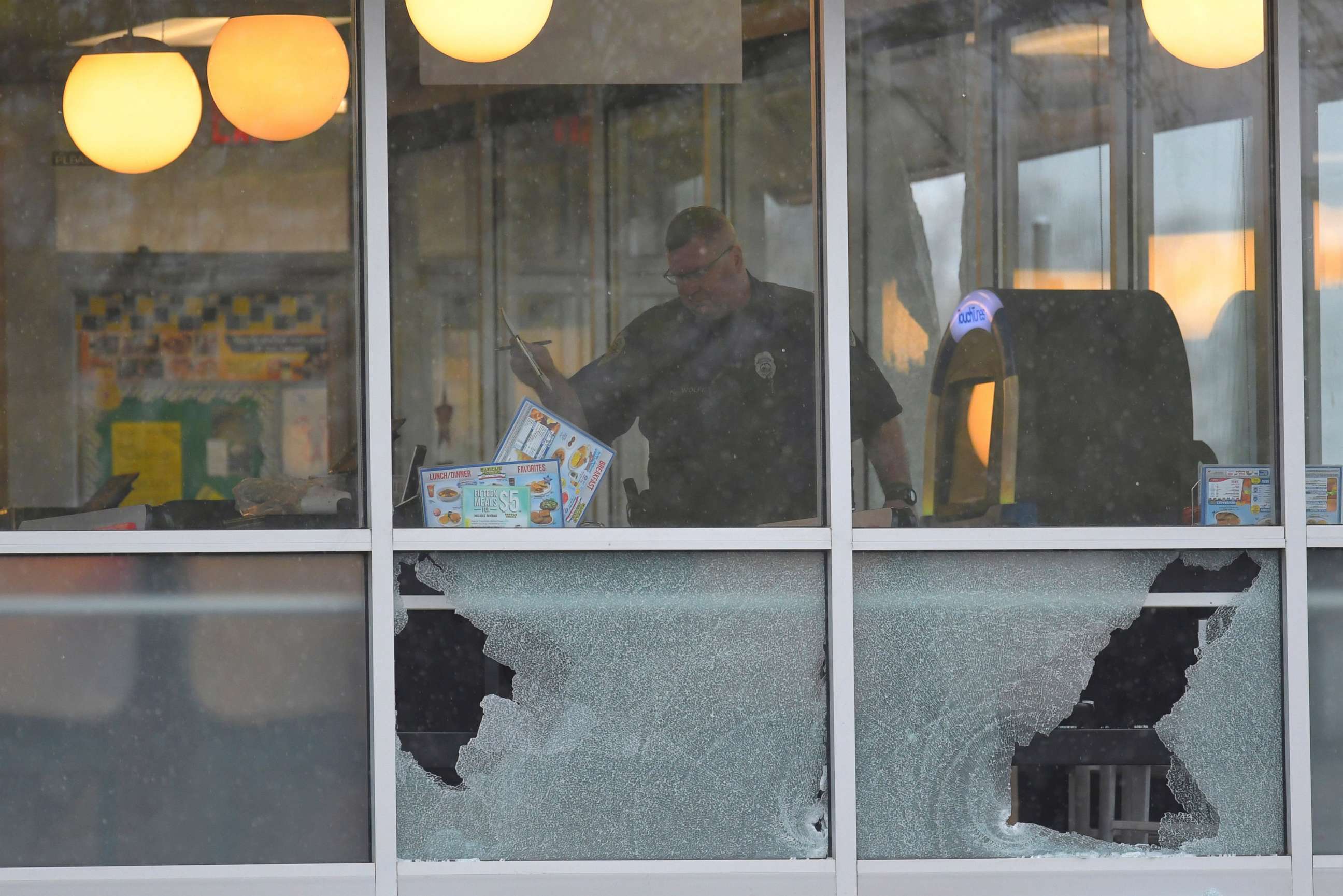 PHOTO: Metro Davidson County Police inspect the scene of a fatal shooting at a Waffle House restaurant near Nashville, Tennessee,  April 22, 2018.  