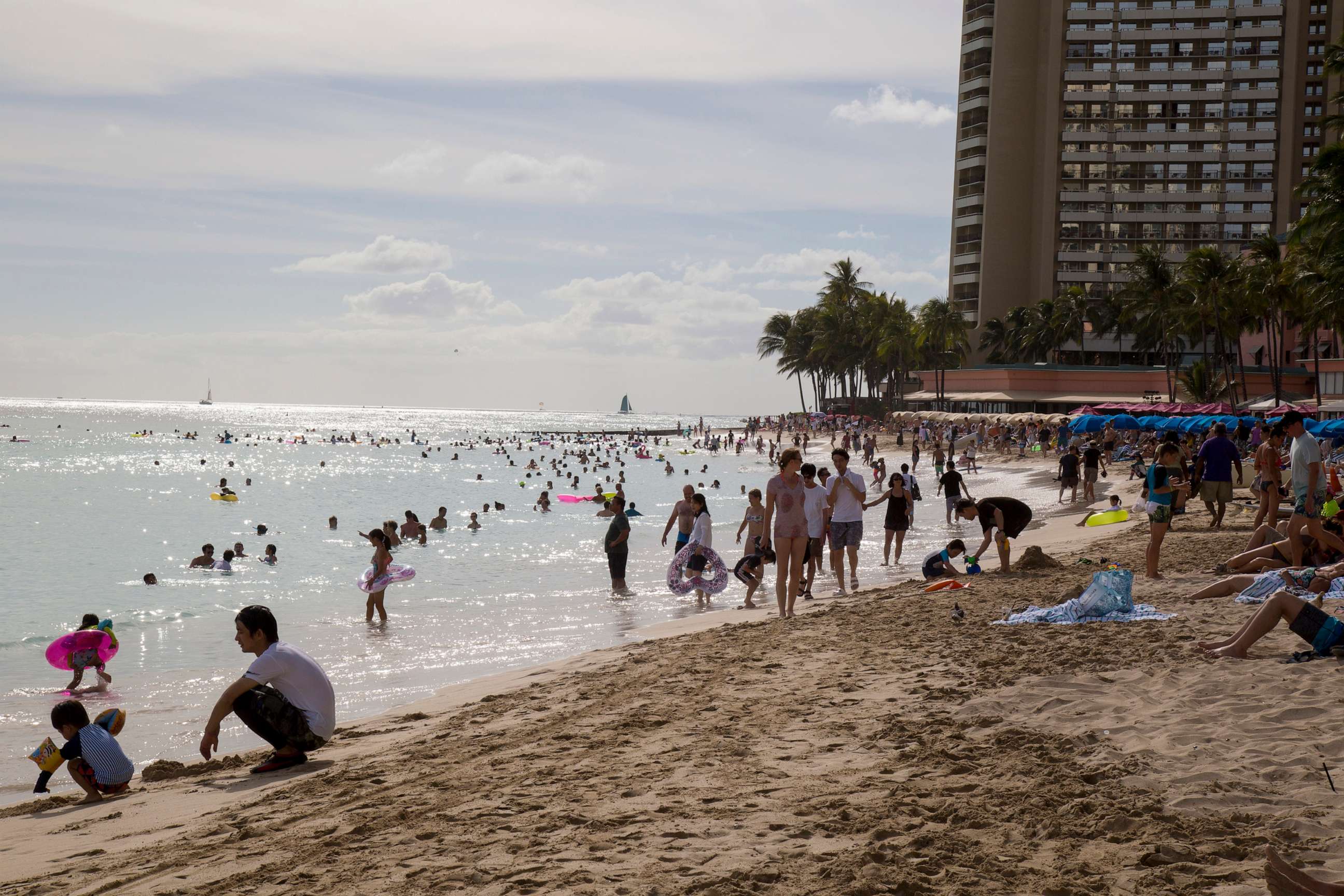 PHOTO: Both tourists and locals enjoy the day at Waikiki beach, Aug. 22, 2018, in Honolulu.