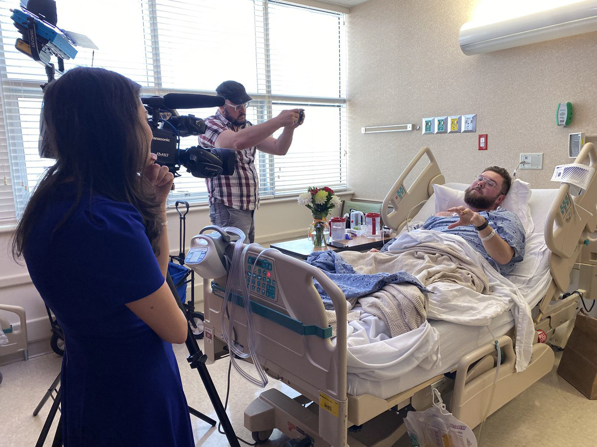 PHOTO: Photojournalist Jesse Walden is visited by colleagues in the hospital after being shot in Orlando, Feb. 22, 2023.