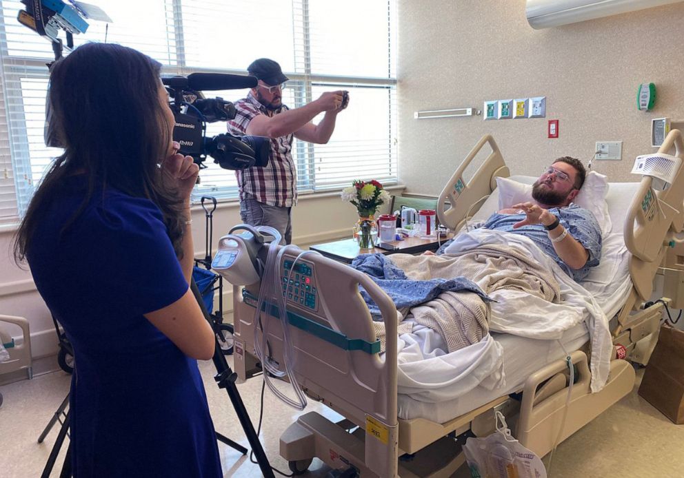 PHOTO: Photojournalist Jesse Walden is visited by colleagues in the hospital after being shot in Orlando, Feb. 22, 2023.