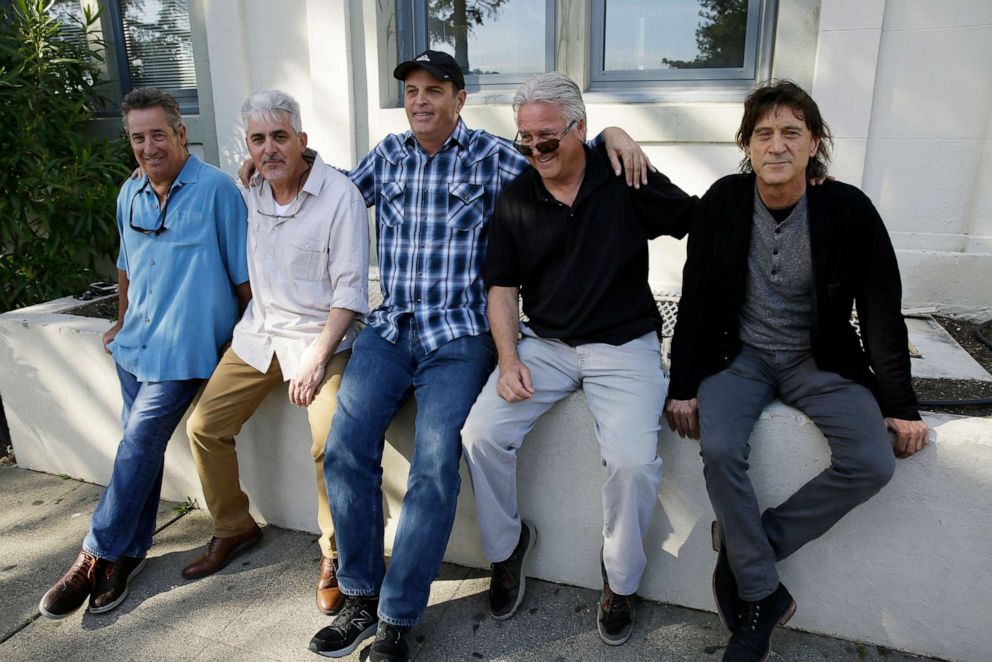 PHOTO: The Waldos, from left, Mark Gravitch, Larry Schwartz, Dave Reddix, Jeffrey Noel and Steve Capper sit on a wall they used to frequent at San Rafael High School in San Rafael, Calif., on, April 13, 2018. 