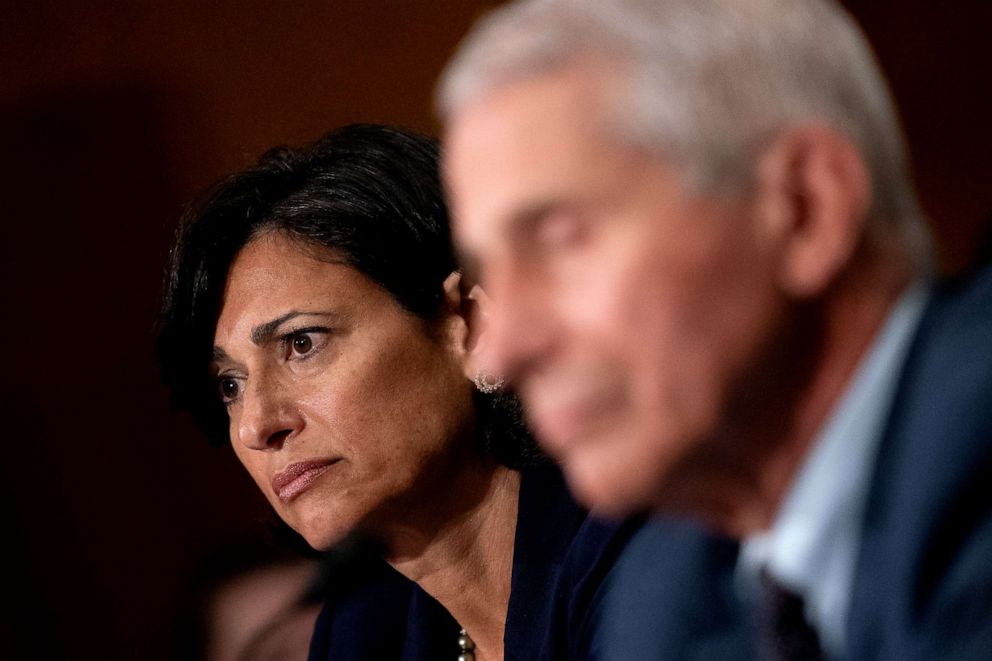 PHOTO: WASHINGTON, DC - JULY 20: Rochelle Walensky, Director of the U.S. Centers for Disease Control and Prevention (CDC), left, and Dr. Anthony Fauci, listen at a Senate Health, Education, Labor, and Pensions Committee hearing.