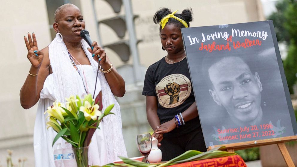 PHOTO: Activist Nana Malaya Rucker, left, performs a libations ceremony outside of the Department of Justice in Washington, D.C., July 8, 2022, for Jayland Walker, the Black man that was shot more than 60 times by police in Akron, Ohio on June 27, 2022.