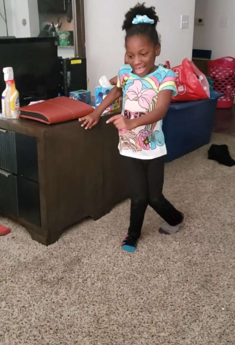 PHOTO: A six-year-old girl with cerebral palsy takes steps without the aid of her walker in Austin, Texas.