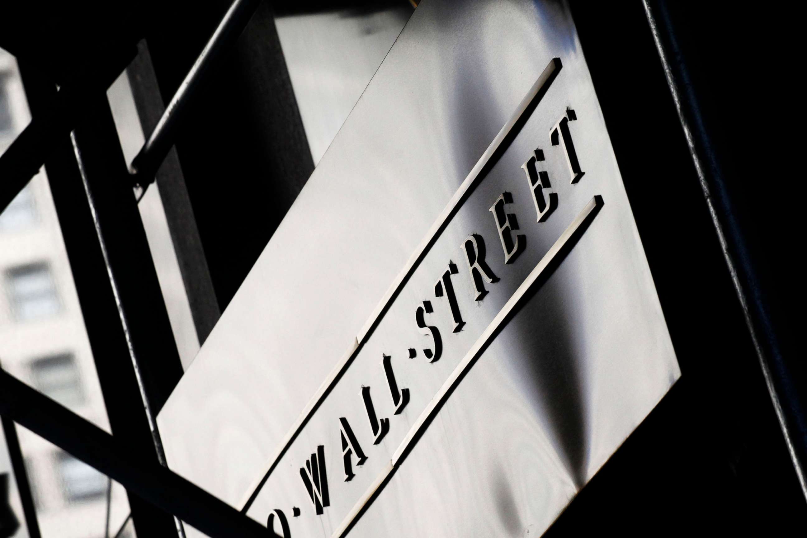 PHOTO: This July 15, 2013, file photo, shows a sign for Wall Street outside the New York Stock Exchange.