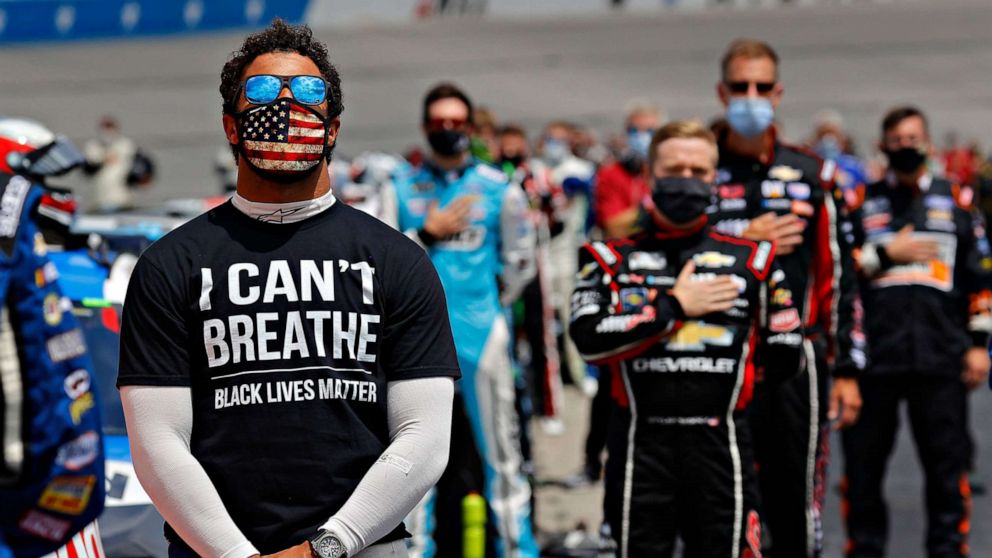 PHOTO: Darrell "Bubba" Wallace wears a "I Can't Breath - Black Lives Matter" T-shirt during the national anthem prior to the NASCAR Cup Series Folds of Honor QuikTrip 500 at Atlanta Motor Speedway, on June 07, 2020, in Hampton, Georgia.