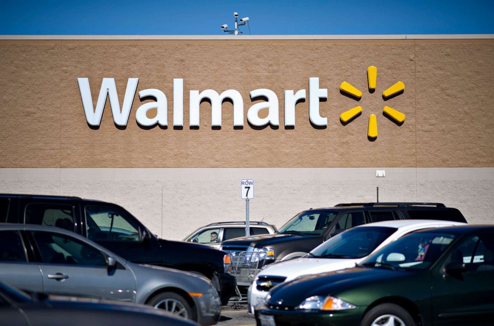 PHOTO: Vehicles sit in the parking lot outside a Wal-Mart store in East Peoria, Illinois, U.S., on Wednesday, Feb. 20, 2013.